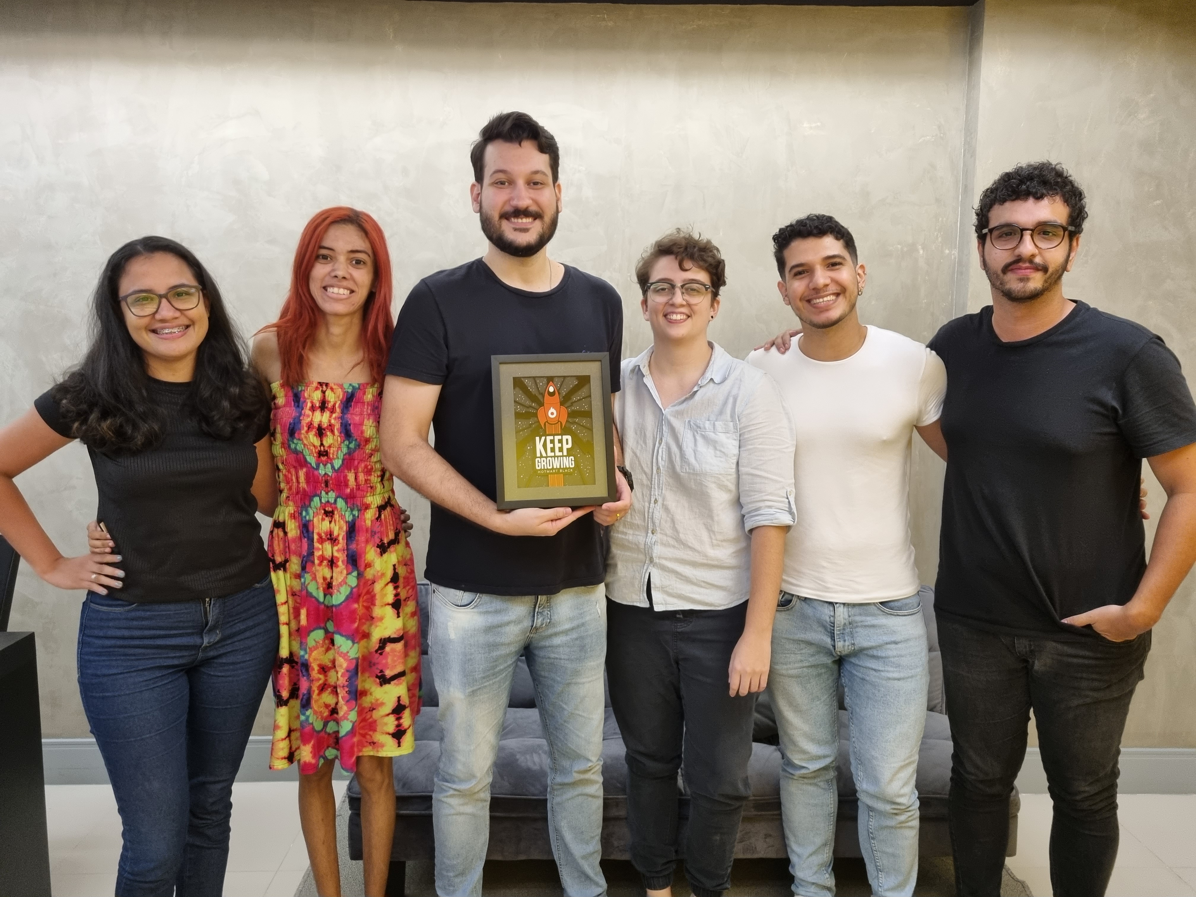 Equipe Sling com o reconhecimento Keep Growing